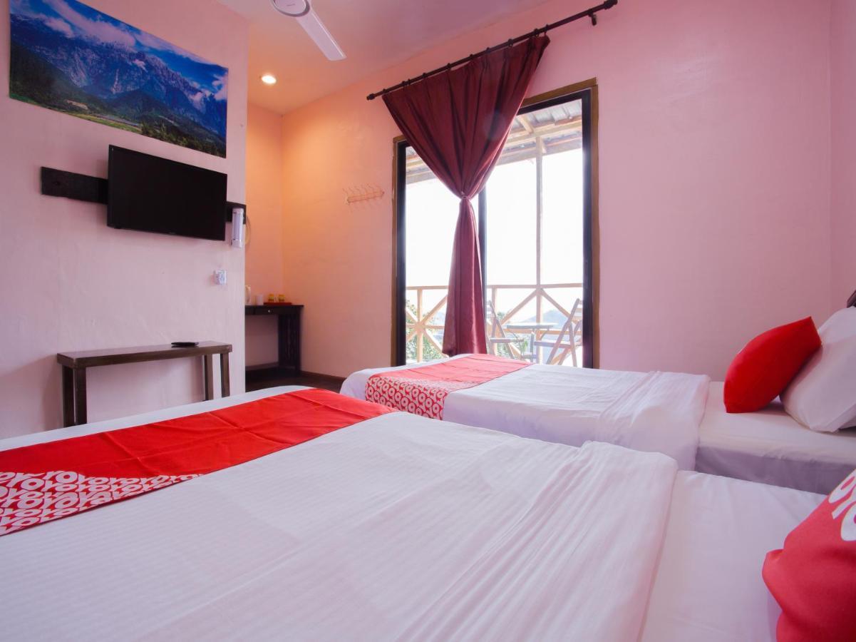 Oyo 90111 Happy Garden Hotel Tenompok Bagian luar foto